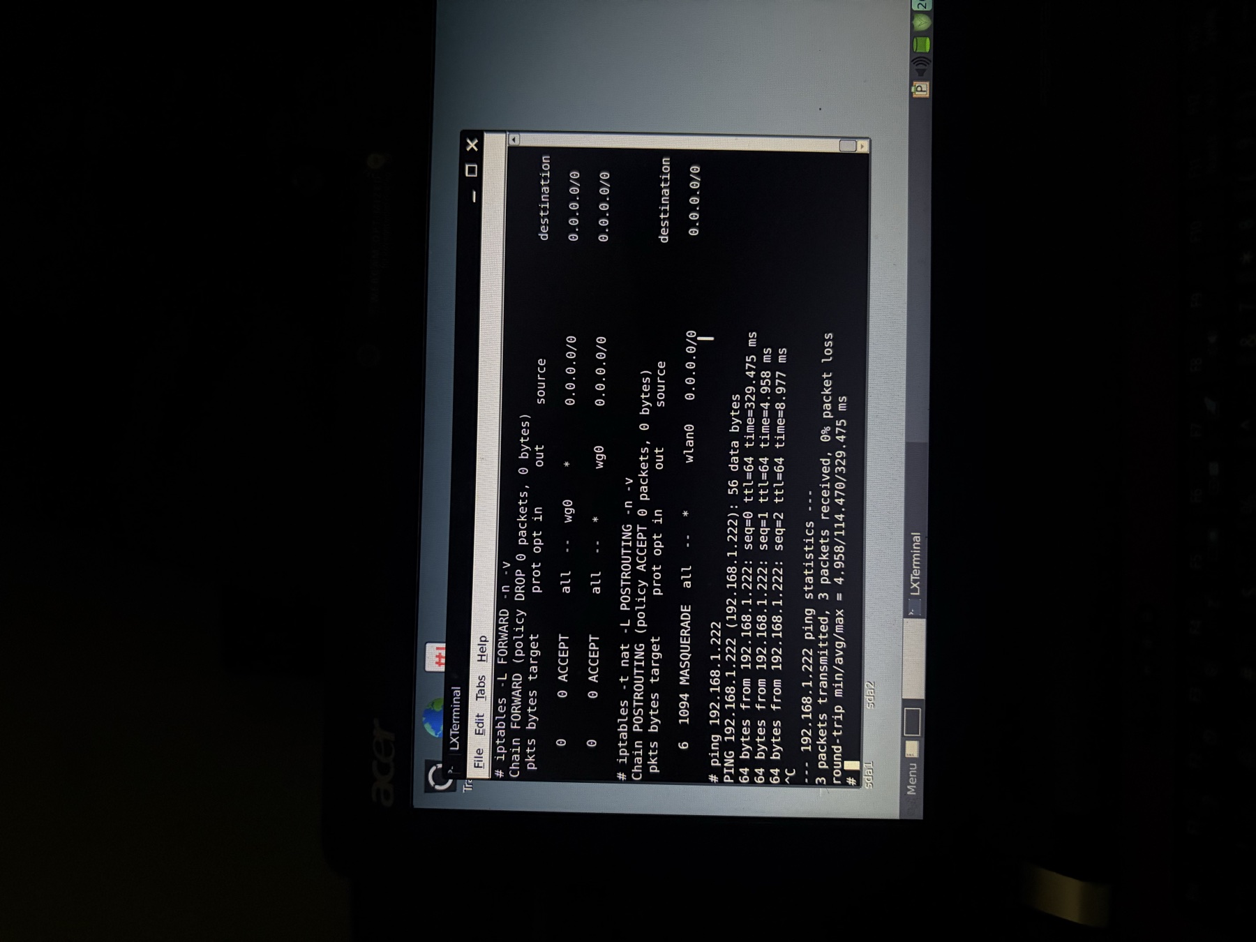 Laptop terminal showing iptables firewall rules and network connectivity checks